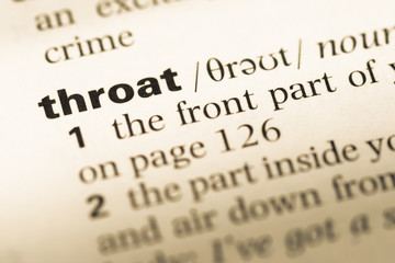 Obraz premium Close up of old English dictionary page with word throat