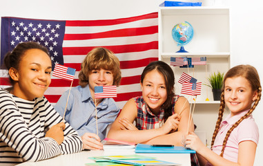 Happy multiethnic students at the geography lesson