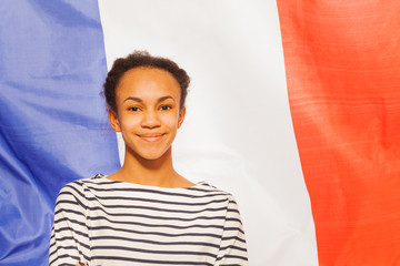 Beautiful African teenage girl with French flag