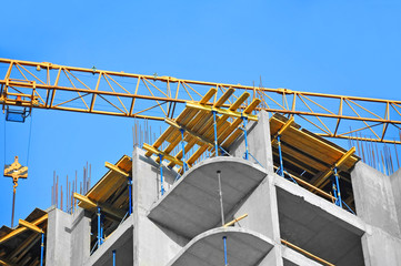 Crane and highrise construction site