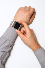 smart watch on a male hand on white background. Mock up. Top view