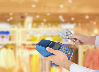 Credit card payment. Businessman with payment terminal and cash
