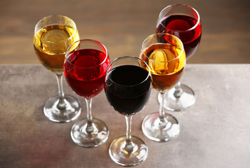 Glasses with wines of different colors on a table