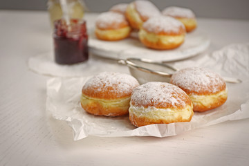 Fresh homemade donuts with powdered sugar, close up
