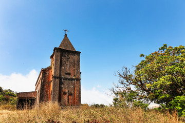 Fototapeta premium Abandoned christian church on top of Bokor mountain in Preah Monivong national park, Kampot, Cambodia