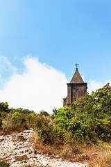 Fototapeta na wymiar Abandoned christian church on top of Bokor mountain in Preah Monivong national park, Kampot, Cambodia