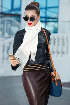 Fashion woman outdoor , fashionable brunnete girl  in black leather jacket, vogue model