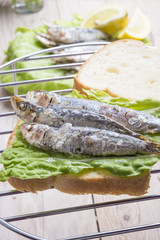 Sandwich Kamut, tapas with sardines, sprats with olives and herb