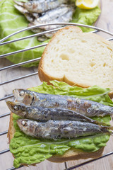 Sandwich Kamut, tapas with sardines, sprats with olives and herb