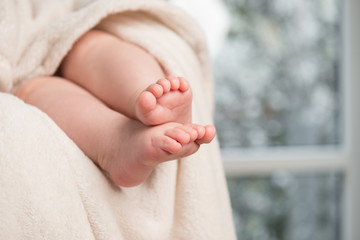 Newborn baby feet and space for text as background