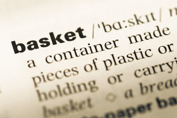 Obraz premium Close up of old English dictionary page with word basket