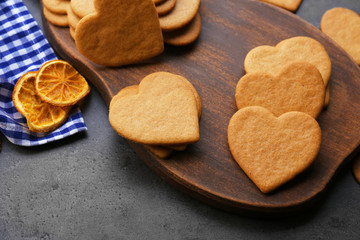 Heart shaped biscuits on cutting board, closeup