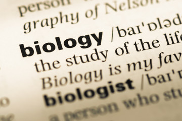 Obraz premium Close up of old English dictionary page with word biology