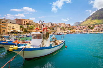 Fototapeta na wymiar Small fishing village with boats at Sicily, Castellammare, Italy