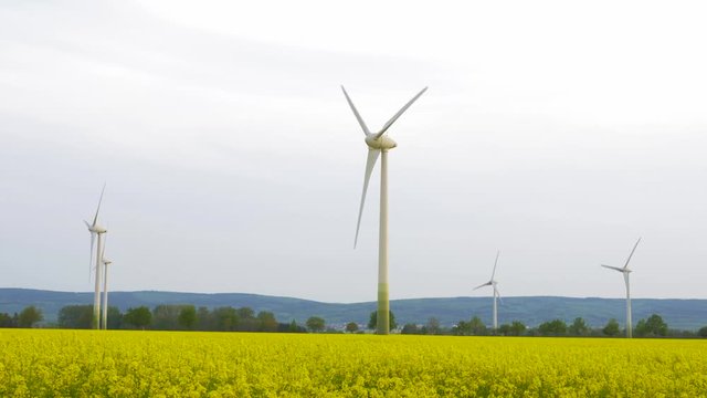  wind turbines generating electricity in nature