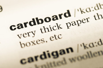 Close up of old English dictionary page with word cardboard