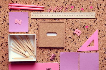 Stationery on cork desk background