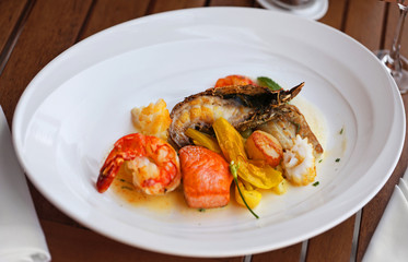 Seafood dish on a wooden table.