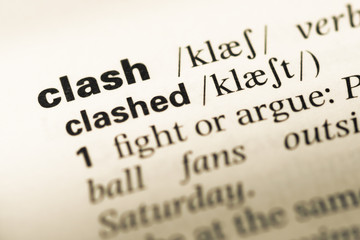Obraz premium Close up of old English dictionary page with word clash