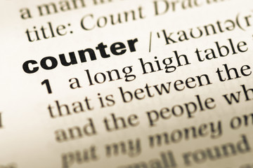 Obraz premium Close up of old English dictionary page with word counter