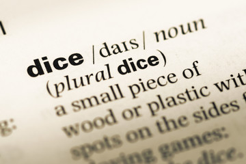 Obraz premium Close up of old English dictionary page with word dice