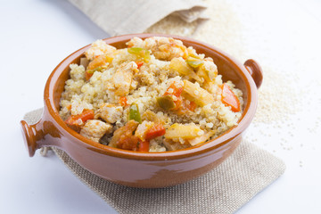 High-key image of white plate with quinoa lentil salad and bowl