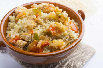 High-key image of white plate with quinoa lentil salad and bowl