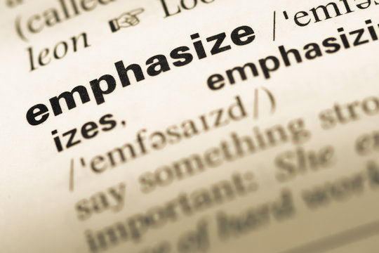 Close up of old English dictionary page with word emphasize