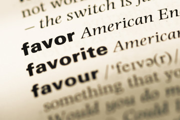 Fototapeta premium Close up of old English dictionary page with word favor