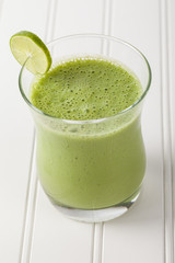 Lime green pineapple smoothie angled view
