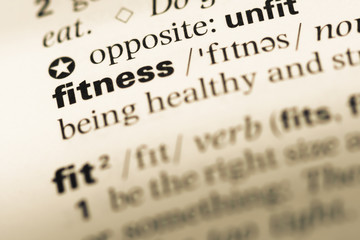 Close up of old English dictionary page with word fitness