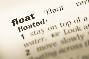 Fototapeta premium Close up of old English dictionary page with word float