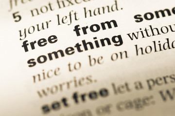 Obraz premium Close up of old English dictionary page with word free from
