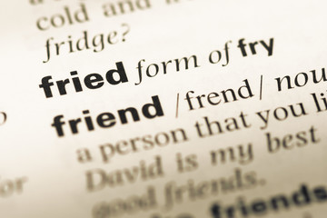 Fototapeta premium Close up of old English dictionary page with word fried