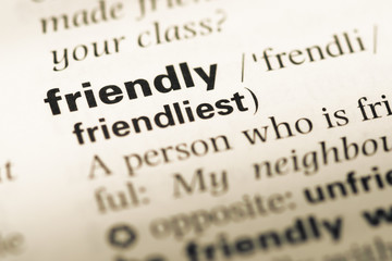 Close up of old English dictionary page with word friendly