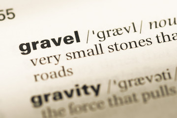 Fototapeta premium Close up of old English dictionary page with word gravel