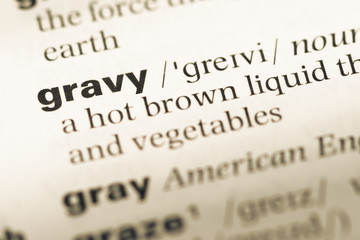Obraz premium Close up of old English dictionary page with word gravy