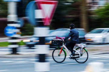 bicycle rider in city traffic