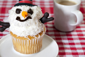 snowman cupcake with coffee