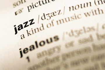 Fototapeta premium Close up of old English dictionary page with word jazz