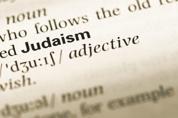 Close up of old English dictionary page with word judaism