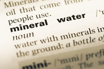 Close up of old English dictionary page with word mineral water