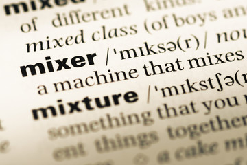 Fototapeta premium Close up of old English dictionary page with word mixer