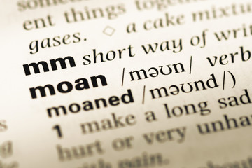 Close up of old English dictionary page with word mm