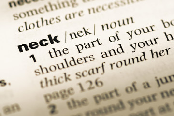 Fototapeta premium Close up of old English dictionary page with word neck