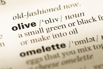 Obraz premium Close up of old English dictionary page with word olive