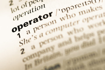 Close up of old English dictionary page with word operator