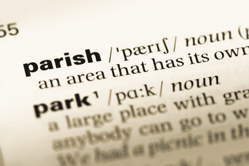 Obraz premium Close up of old English dictionary page with word parish