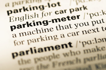 Fototapeta premium Close up of old English dictionary page with word parking meter