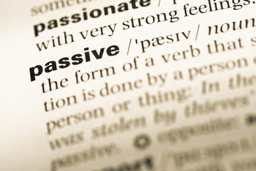 Fototapeta premium Close up of old English dictionary page with word passive